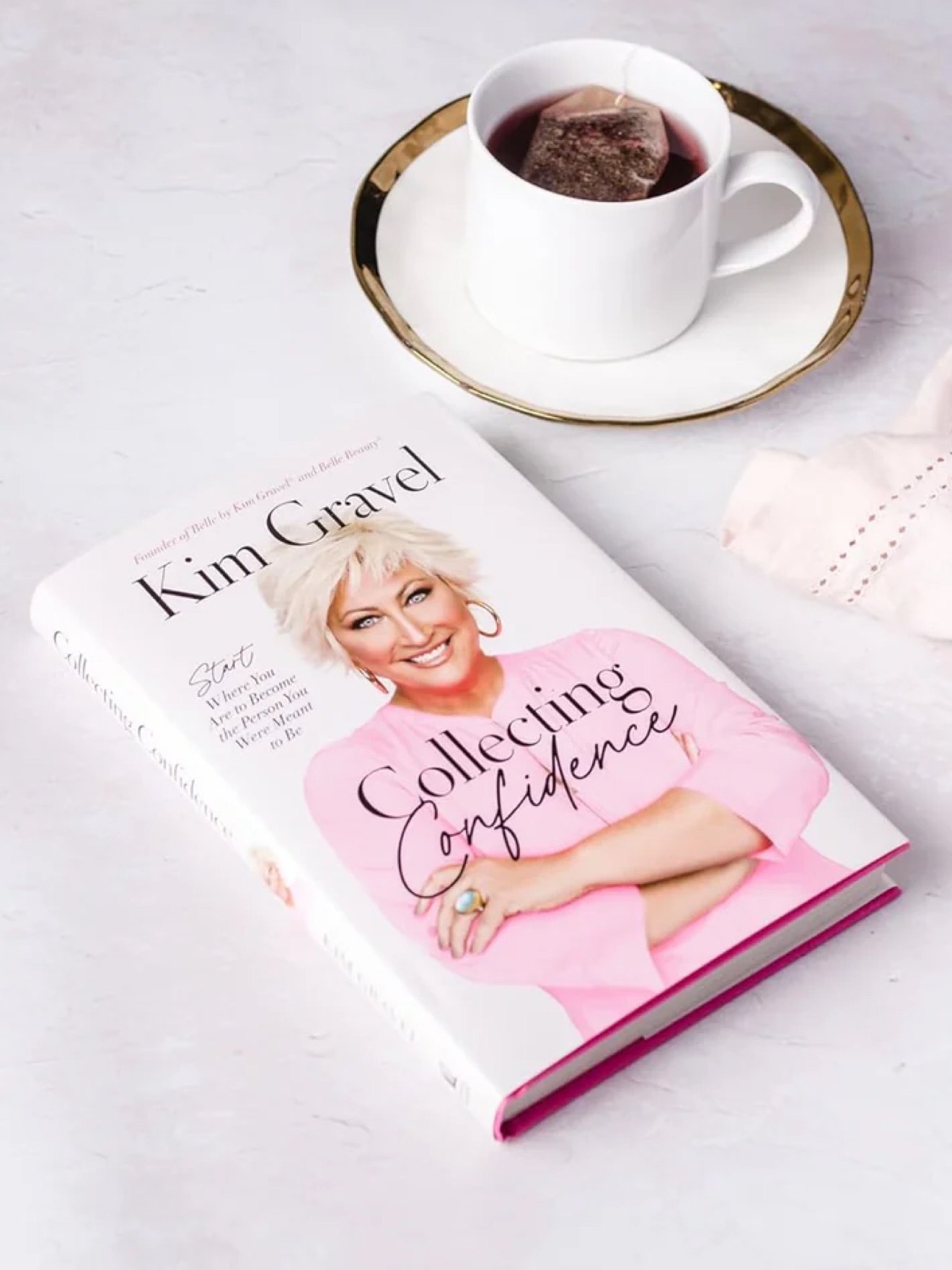 Collecting Confidence hardcover styled with a cup of tea